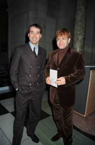 Elton John And David Furnish British singer Elton John (right) and partner David Furnish attend the launch party for David Lindley's 'Extraordinary Furniture' book at the Victoria and Albert Museum, London, October 1996.