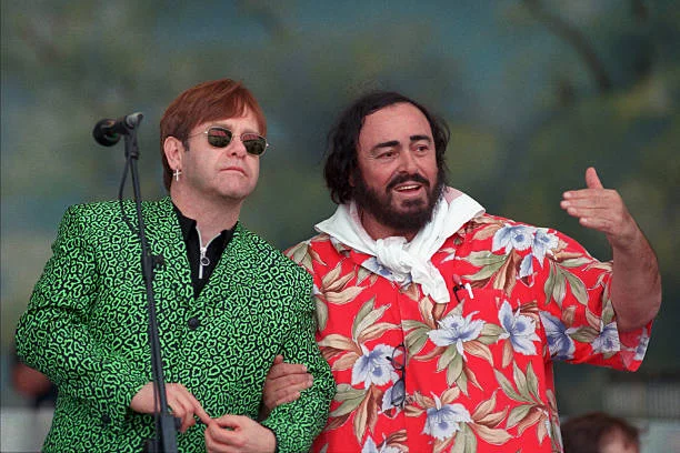 MODENA, ITALY - SEPTEMBER 06: The picture shows opera singer Luciano Pavarotti (R) with Sir Elton John during the 1996 Pavarotti & Friends charity concert, in Modena, Italy.
