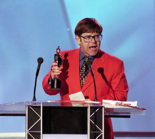 The BRIT Awards 17th Show with Britannia Music Club Elton John presenter of British Male Solo Artist during The BRIT Awards 1997, Monday 24 February 1997, Earls Court Exhibition Centre, London, England