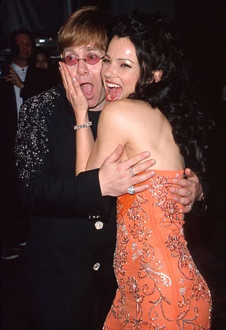 Date: March 23, 1998  Location: Beverly Hills, California, USA Event: 70th Annual Academy Awards – Elton John AIDS Foundation Party Attendees: Elton John, Fran Drescher (among others)